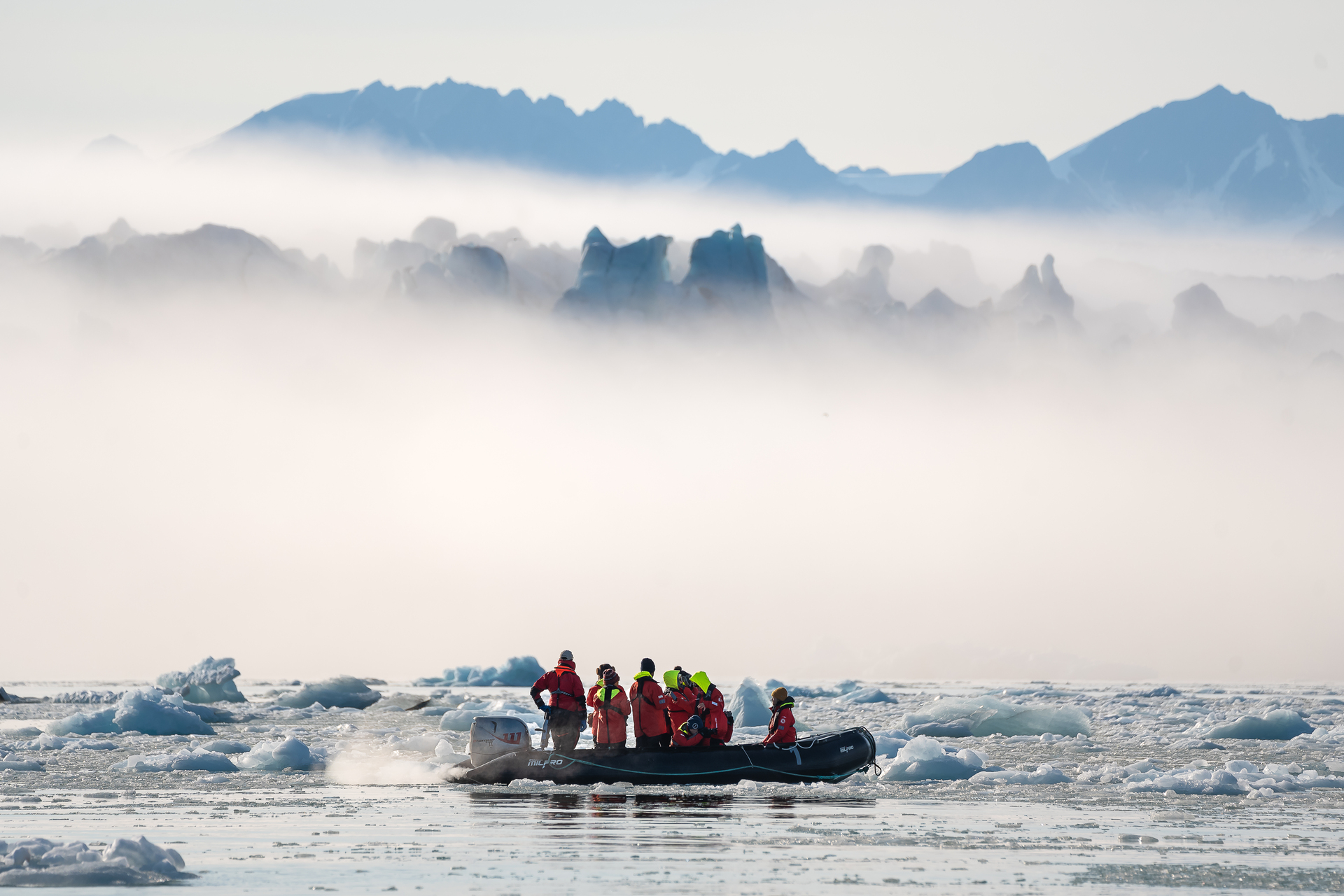 HX-Svalbard-26 Guests on zodiacs in Svalbard Scenery