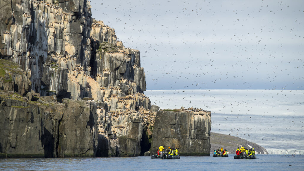 Zodiacs in Svalbard Scenery