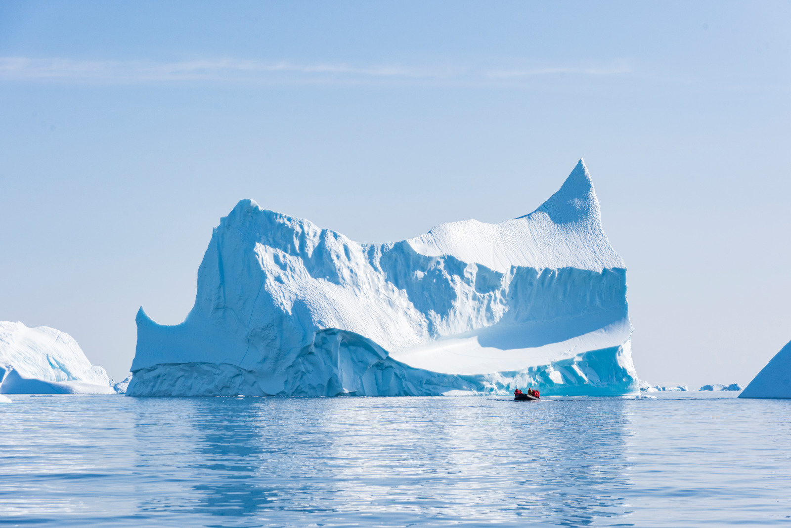 Iceberg-and-Zodiac-on-an-Arctic-Icebreaker-cruise-PONANT Iceberg in greenland