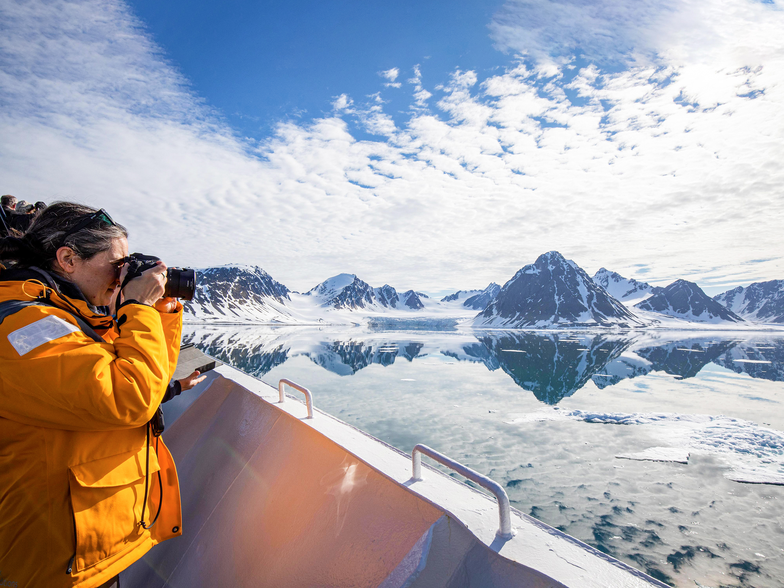 Svalbard-Explorer-expedition-cruise-Quark person taking photo in Svalbard