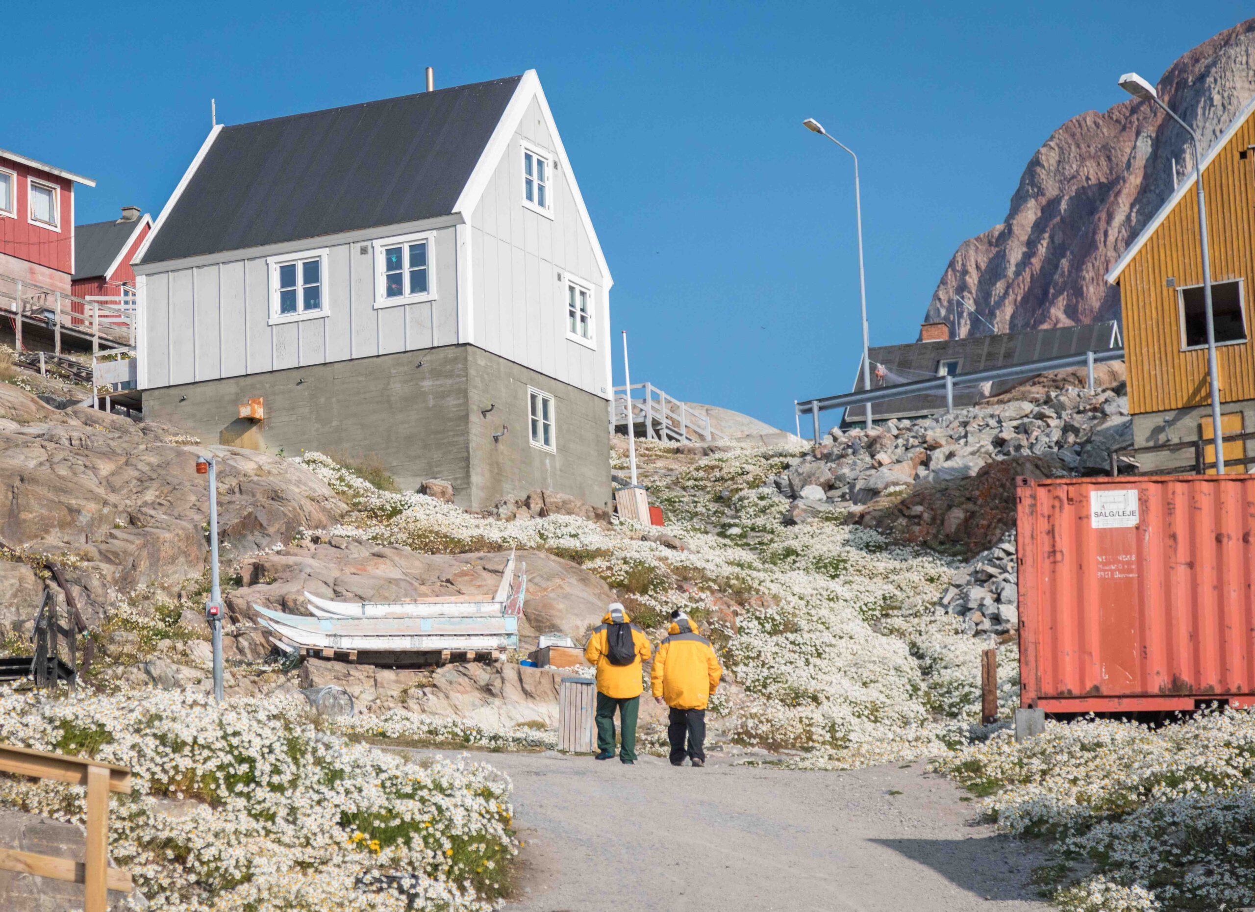 guests-walking-Uumannaq-Community People walking up to town in greenland